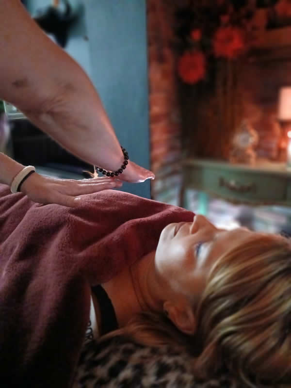 pic of ladys head with hands over her