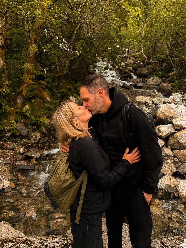 Heather kissing her husband